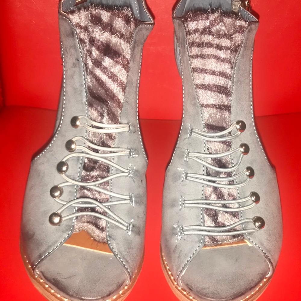 Open toe heel boots.